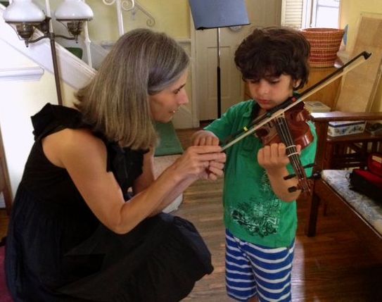 Violin student Tristan takes in the lovely techniques shown him by his teacher Constance during his violin lessons at her Beverly Hills violin studio.