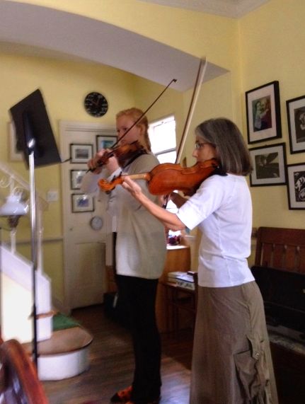 Beverly Hills violin student Julia learning new material with her teacher, Constance, during her lesson.